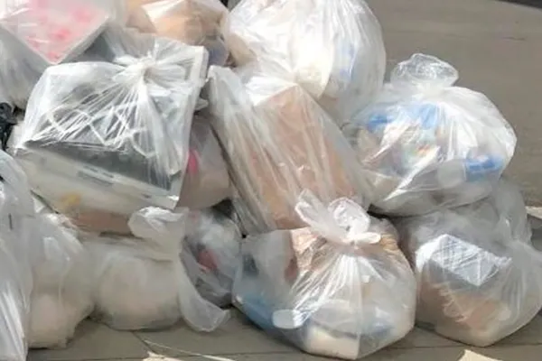 Clear bags of recyclables set out for collection