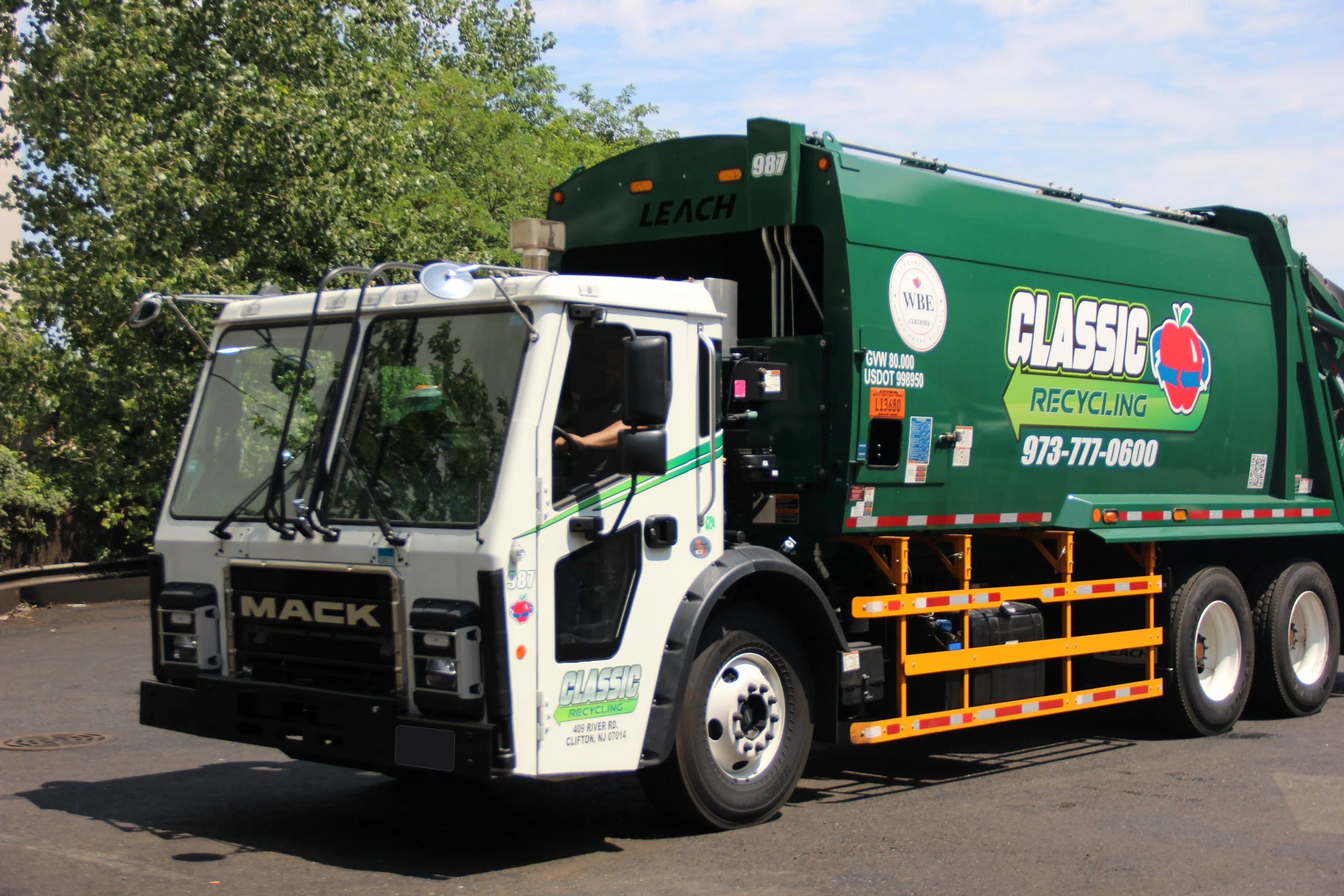 A Classic Recycling driver at the wheel of a truck in the company yard